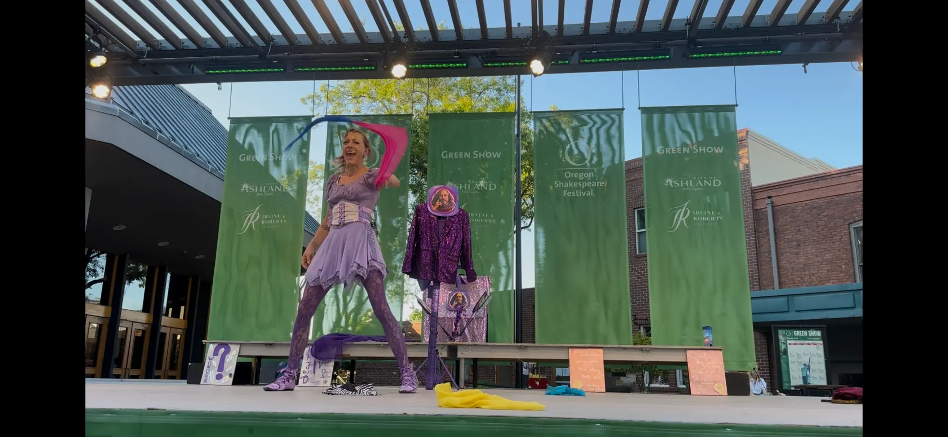 Jenifer Joy tossing colorful scarves into the air during The Merry Yo-Yo of Windsor
