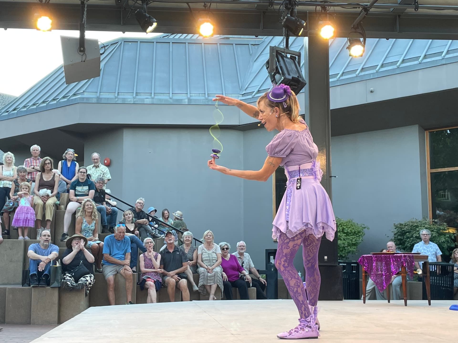 Close-up of a yo-yo string trick on the Green Show stage in Ashland, Oregon