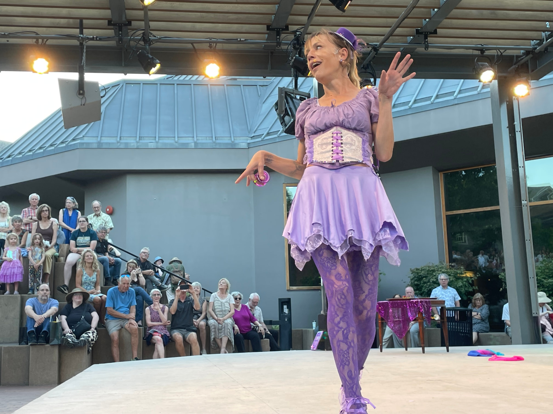 Jenifer Joy addressing the audience mid-show in her purple Merry Yo-Yo of Windsor costume